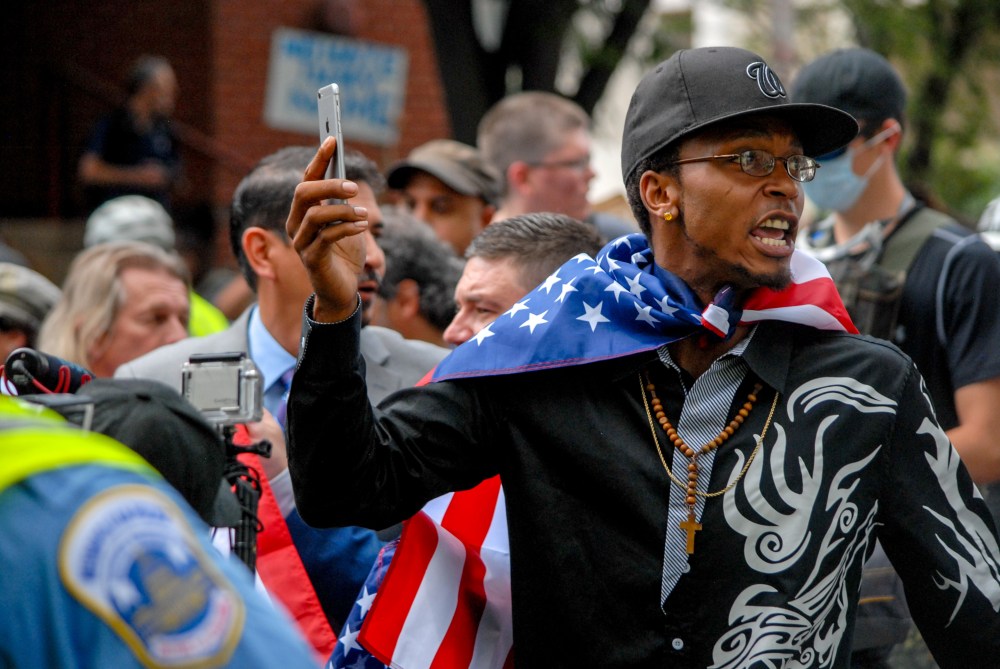 A man marches with white supremacist Jason Kessler during the Unite the Right 2 event in Washington D.C. on Sunday, Aug. 12, 2018. 
